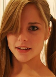 Cute and innocent dirty blonde in pigtails