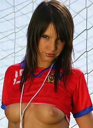 Sexy brunette goalkeeper stripping